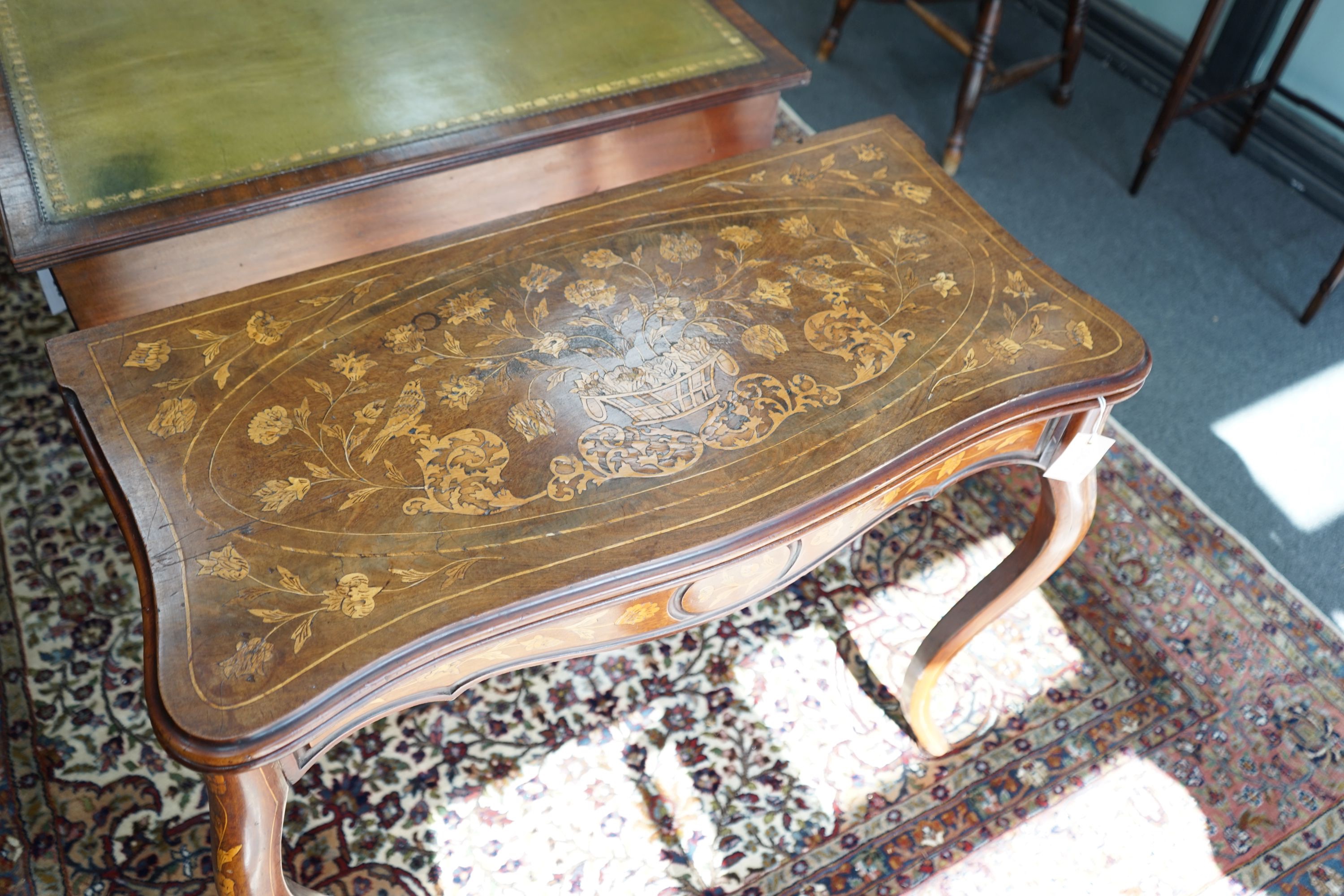 A 19th century Dutch mahogany and marquetry games table, width 85cm depth 43cm height 75cm